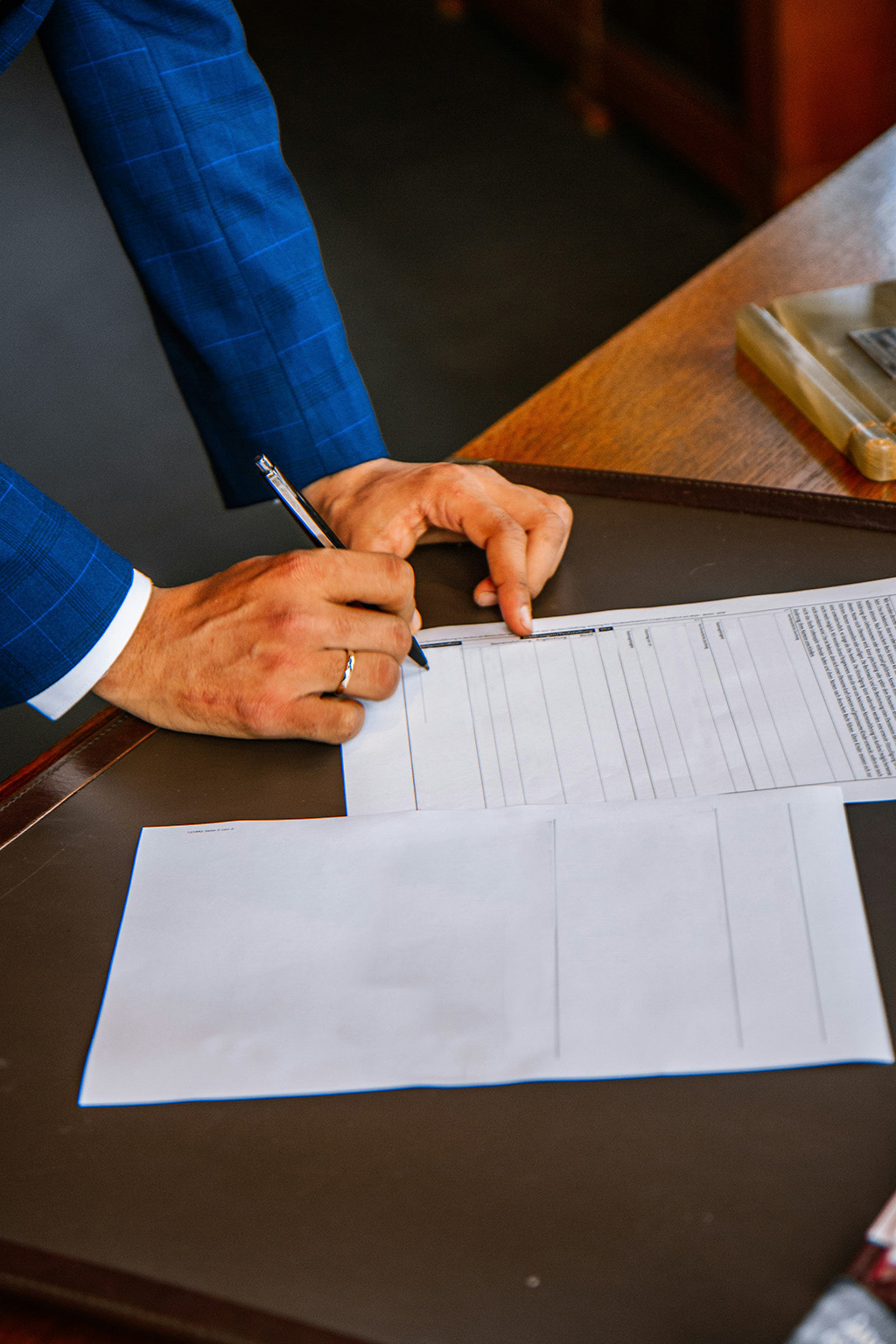 Attorney Charlie Lane with a mortgage loan officer, both in suits